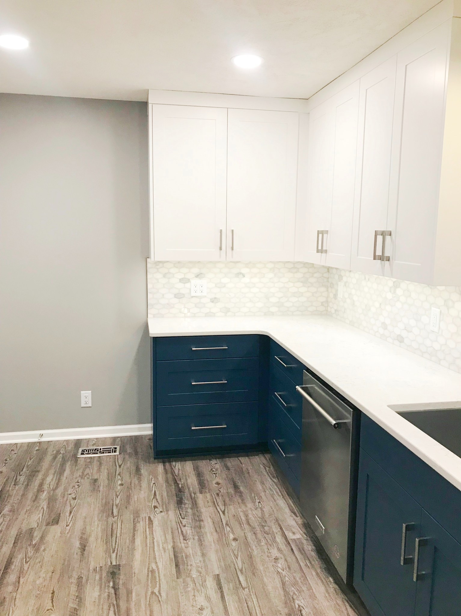 Dark Blue Lower Cabinets With White Upper Cabinets Kitchen Remodel by BAJCO Construction project photo 6